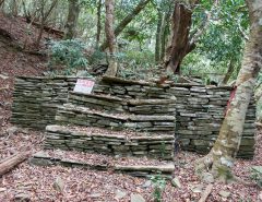 Stairs and platform made from old stones - trees in background